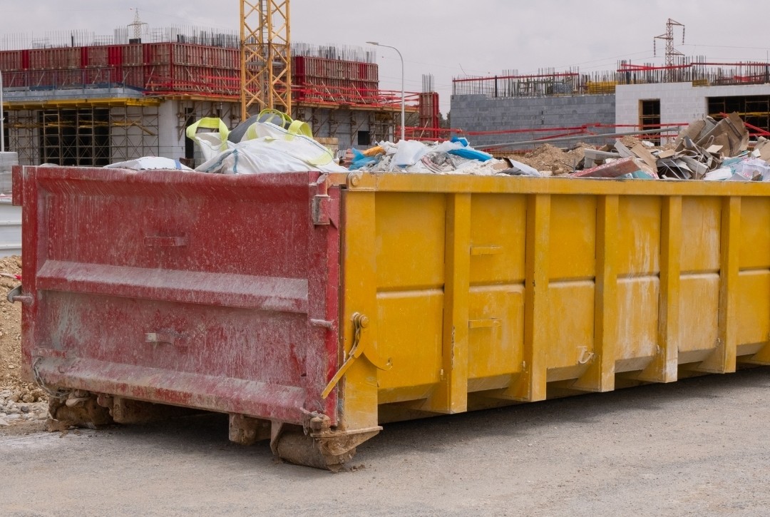 Construction dumpster on job site